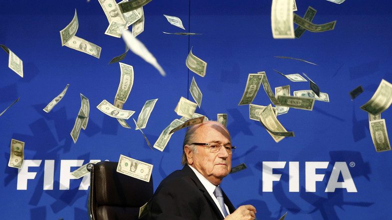 British comedian known as Lee Nelson (unseen) throws banknotes at FIFA President Sepp Blatter as he arrives for a news conference after the Extraordinary FIFA Executive Committee Meeting at the FIFA headquarters in Zurich, Switzerland July 20, 2015. World football's troubled governing body FIFA will vote for a new president, to replace Sepp Blatter, at a special congress to be held on February 26 in Zurich, the organisation said on Monday.       REUTERS/Arnd Wiegmann   TPX IMAGES OF THE DAY
FOR BEST QUALITY IMAGE ALSO SEE: GF10000187908 - RTX1L1TH