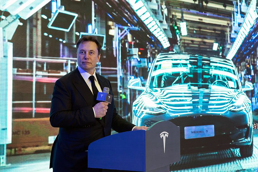 epa08110484 Elon Musk delivers a speech at the delivery ceremony of the first batch of Shanghai made Tesla Model 3 sedans in Shanghai, China, 07 January 2020. Ten customers became the first owners of the electric cars beyond the Tesla staff.  EPA/FC chs CHINA OUT