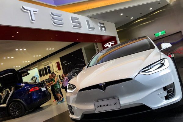 epa06976034 People view Tesla cars at a Tesla showroom center in Taipei, Taiwan, 27 August 2018. Tweets by Tesla CEO Elon Musk that he is considering taking the company private on 07 August 2018, may launch a US Securities and Exchange Commission (SEC) investigation into possible market manipulation.  EPA/RITCHIE B. TONGO